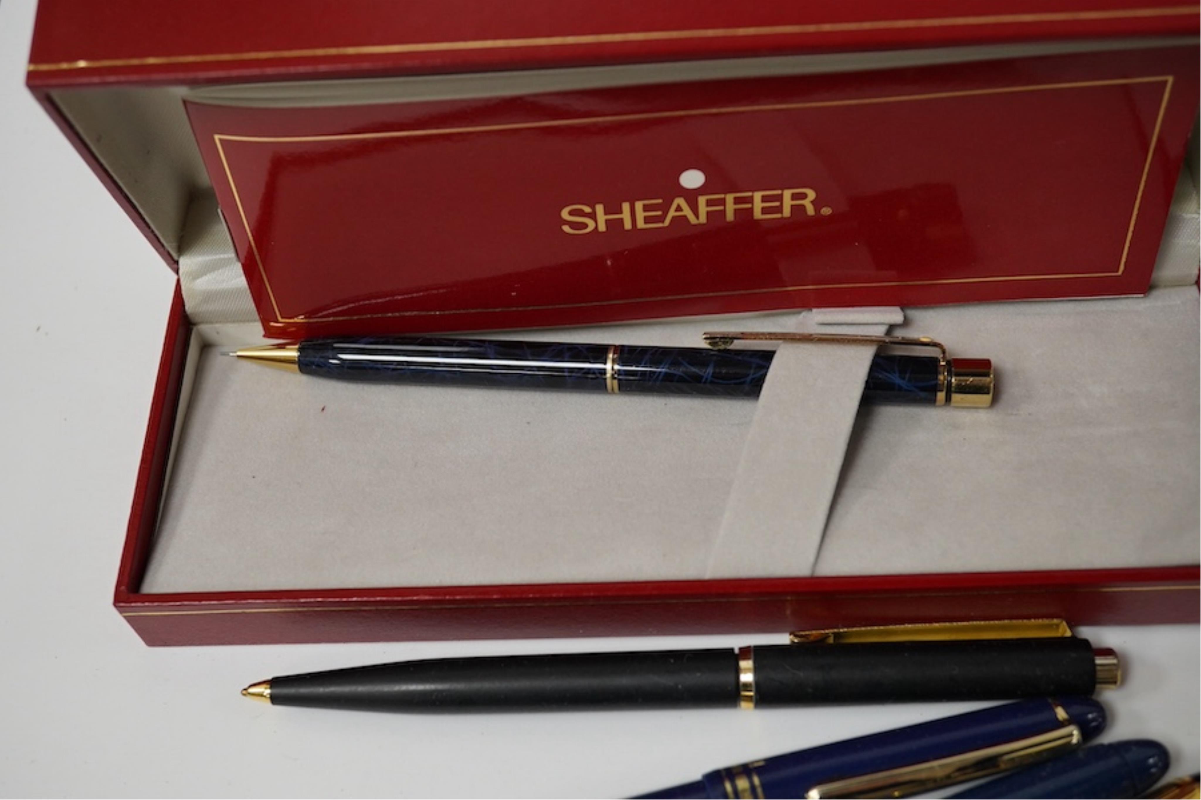 A collection of various pens, a ladies Must de Cartier wrist watch and a H.N. Ansell medal. Condition - varies